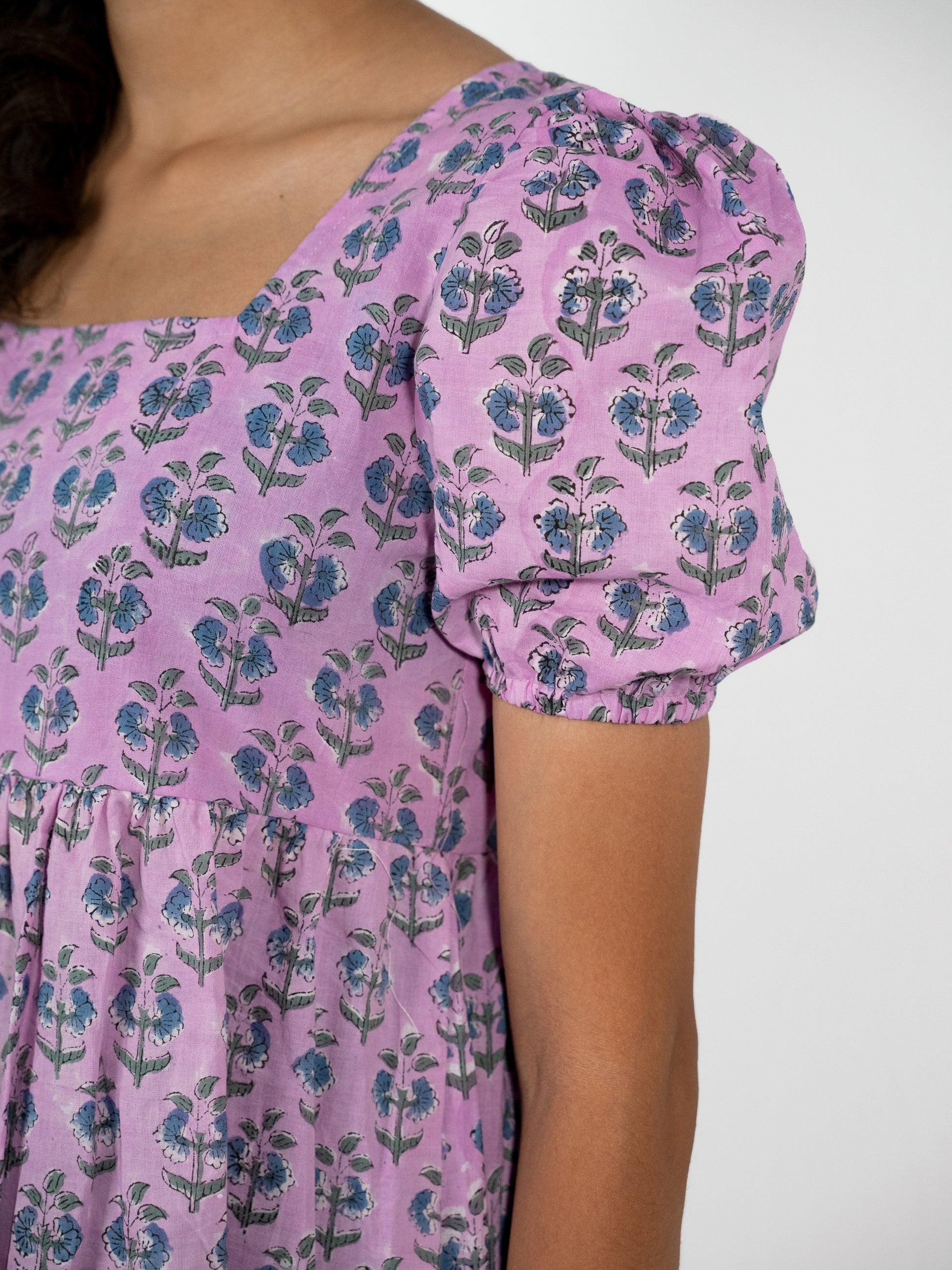 gathered kneelength purple dress with puffed sleeves 