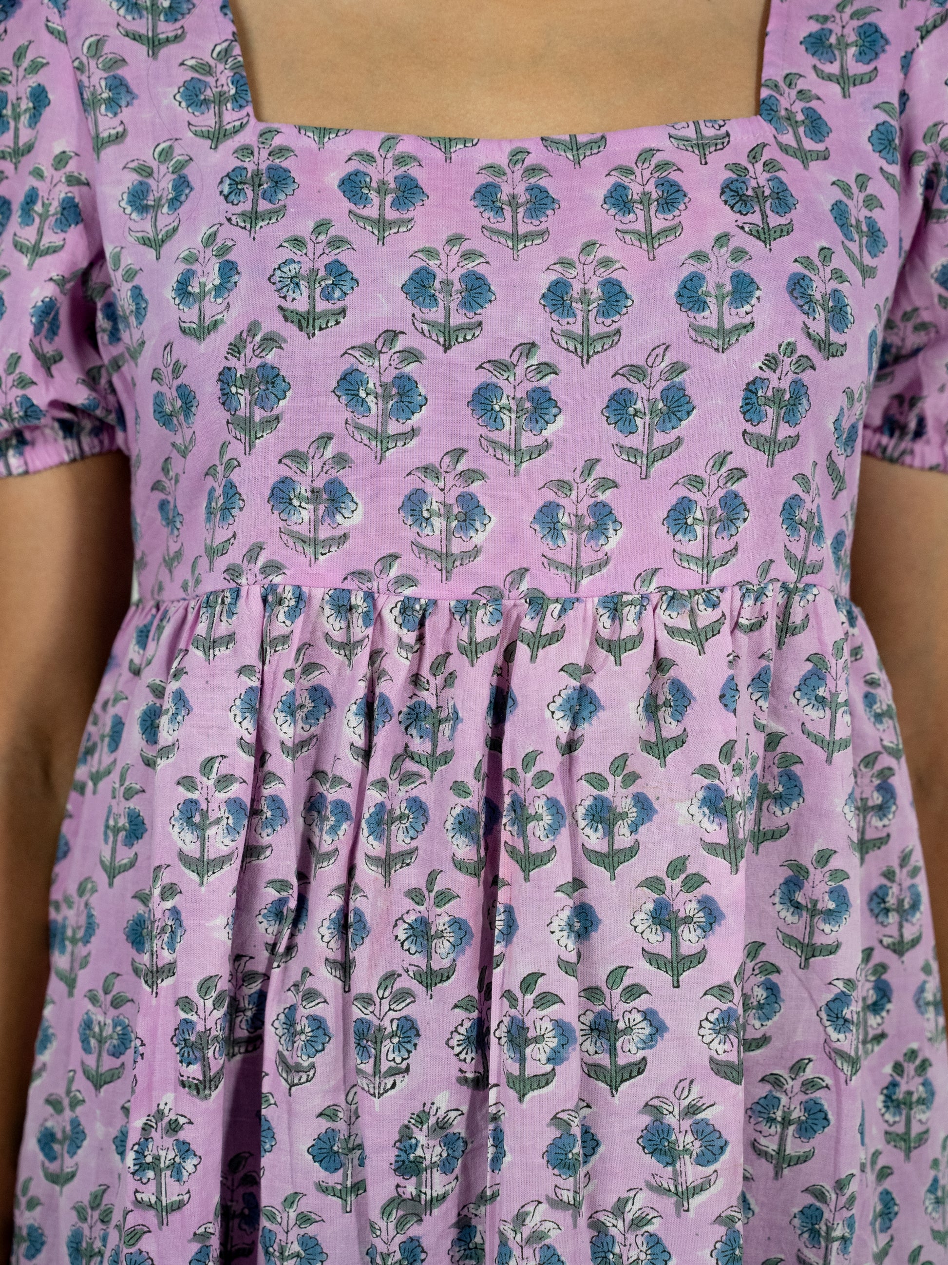 gathered kneelength purple dress with puffed sleeves 